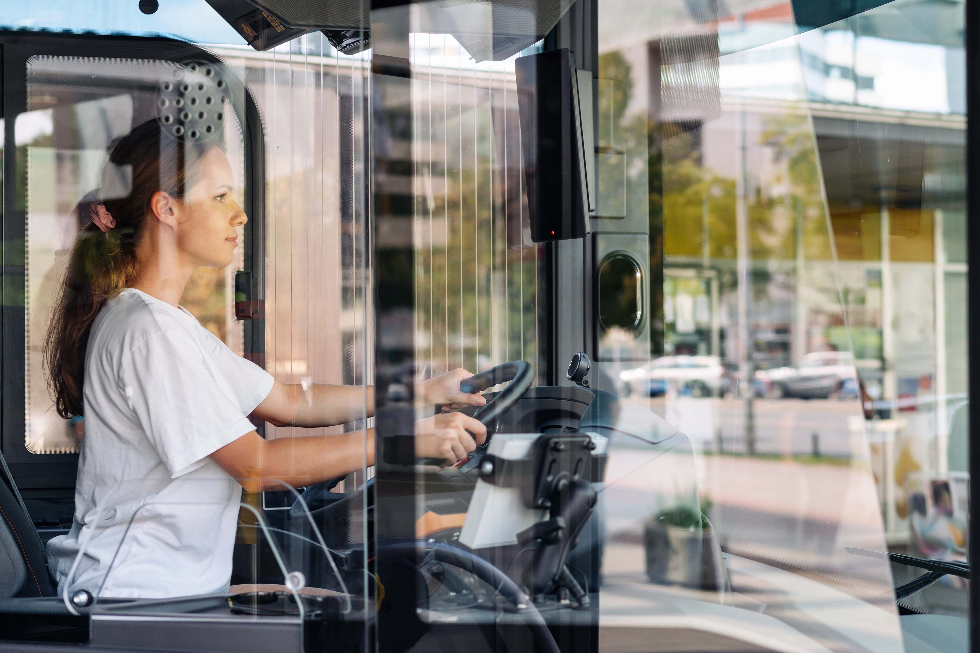 Shuttle bus being driven by a woman