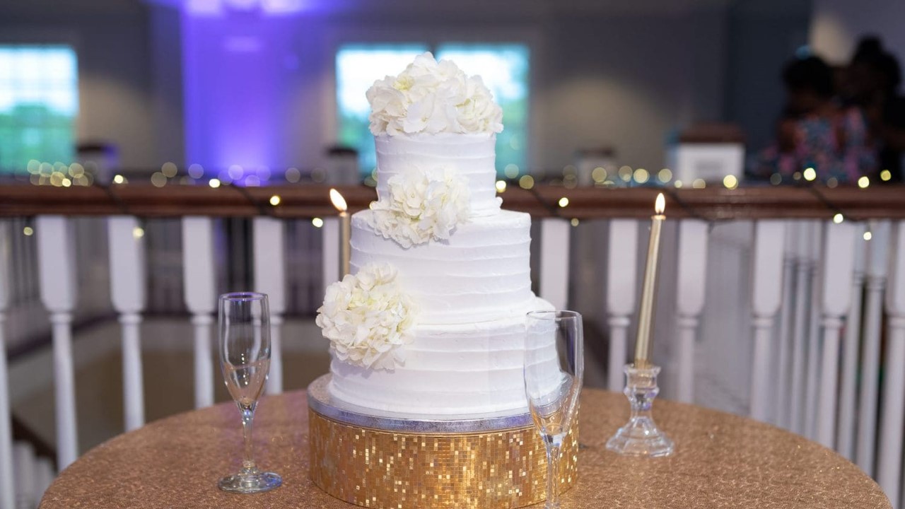 A wedding cake sitting on top of a table